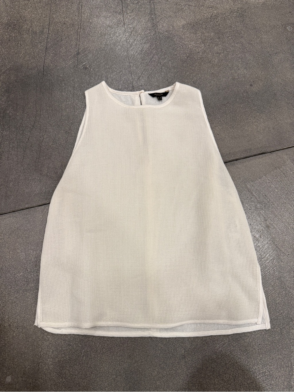 Sleeveless White Knit Top